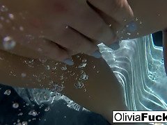 Olivia Austin underwater, playing with her juicy pussy