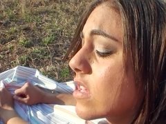 A woman with a hairy pussy is fucked on the grass very deeply