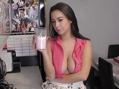 Brunette drinking milk-shake with downblouse