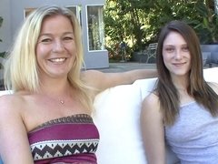 Blonde lesbian MILF fucks younger girl on the couch