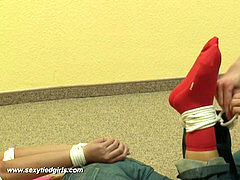 damsel in jeans trussed and ballgagged