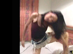 Thai t-girl in jean micro-skirt is dancing and exposing bigtits