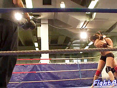 nude lesbos grappling in a boxing ring