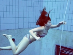 Sizeable bouncing tits underwater