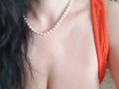 Brunette in orange dress - Big natural tits in solo boob play