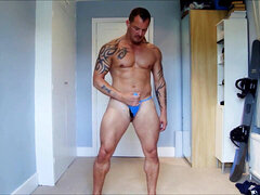 Muscular hunk trying on various new g-strings