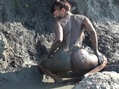 Naughty & Dirty MILF exhibitionist in mud pool on the public beach